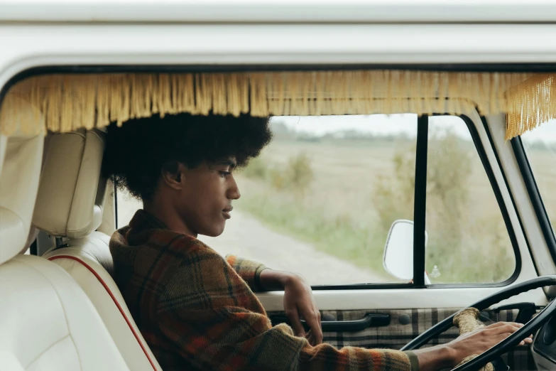 a person riding in a truck and looking out the window