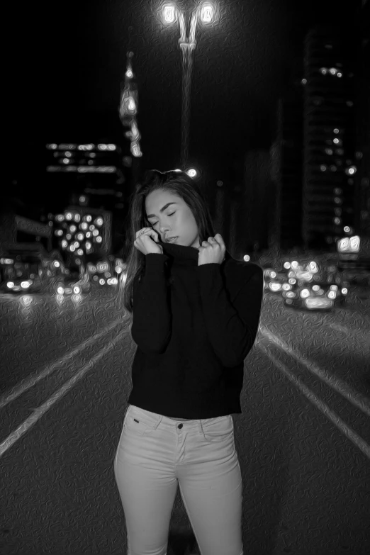 a girl with her head down stands in the middle of a road