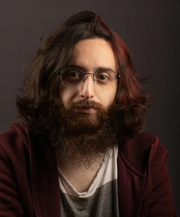 a man wearing glasses and a beard