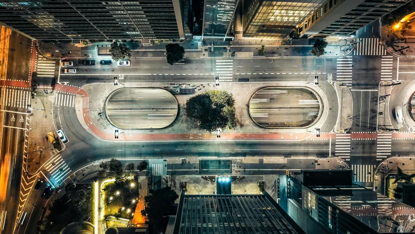 top view of city street intersection with skyscrs and buildings