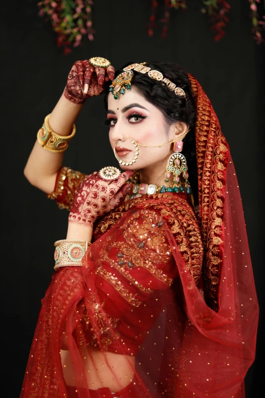 a woman with traditional indian makeup and jewelry