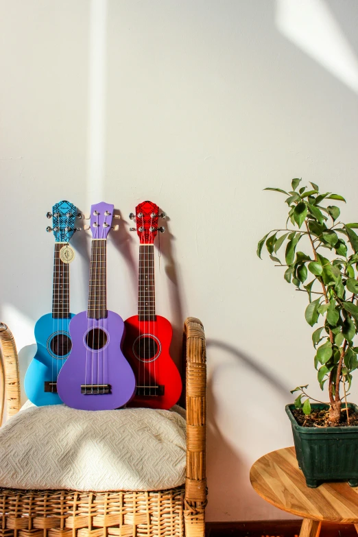 a group of three guitars sitting on a table