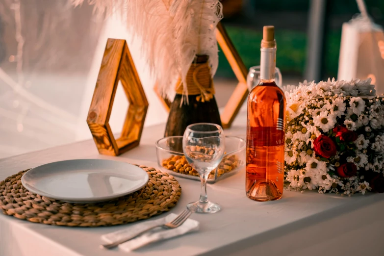 a dining table has a vase and plate