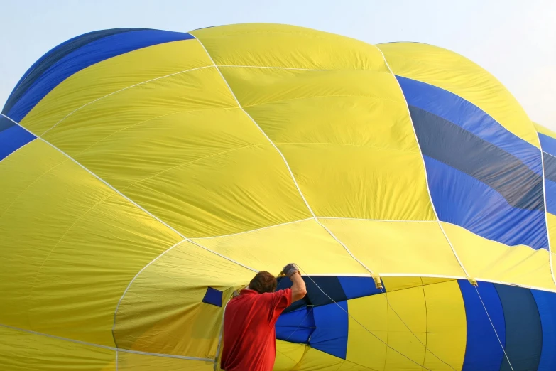 a man is taking pictures of a balloon