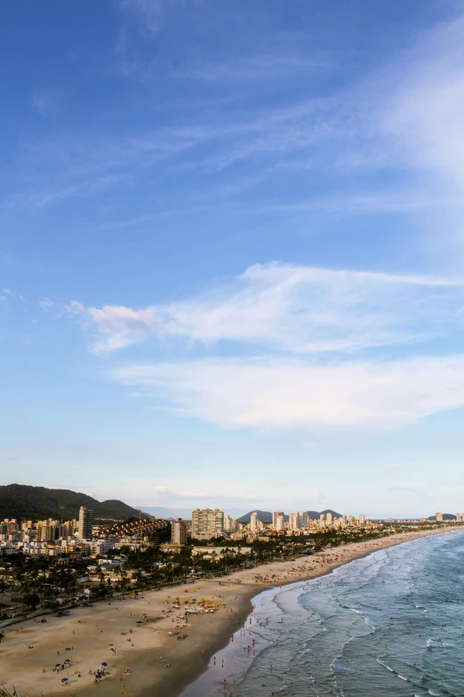 a beautiful sky line shows the city beach and ocean