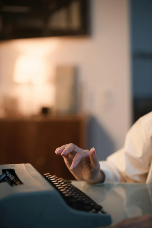 a man that is sitting at a table