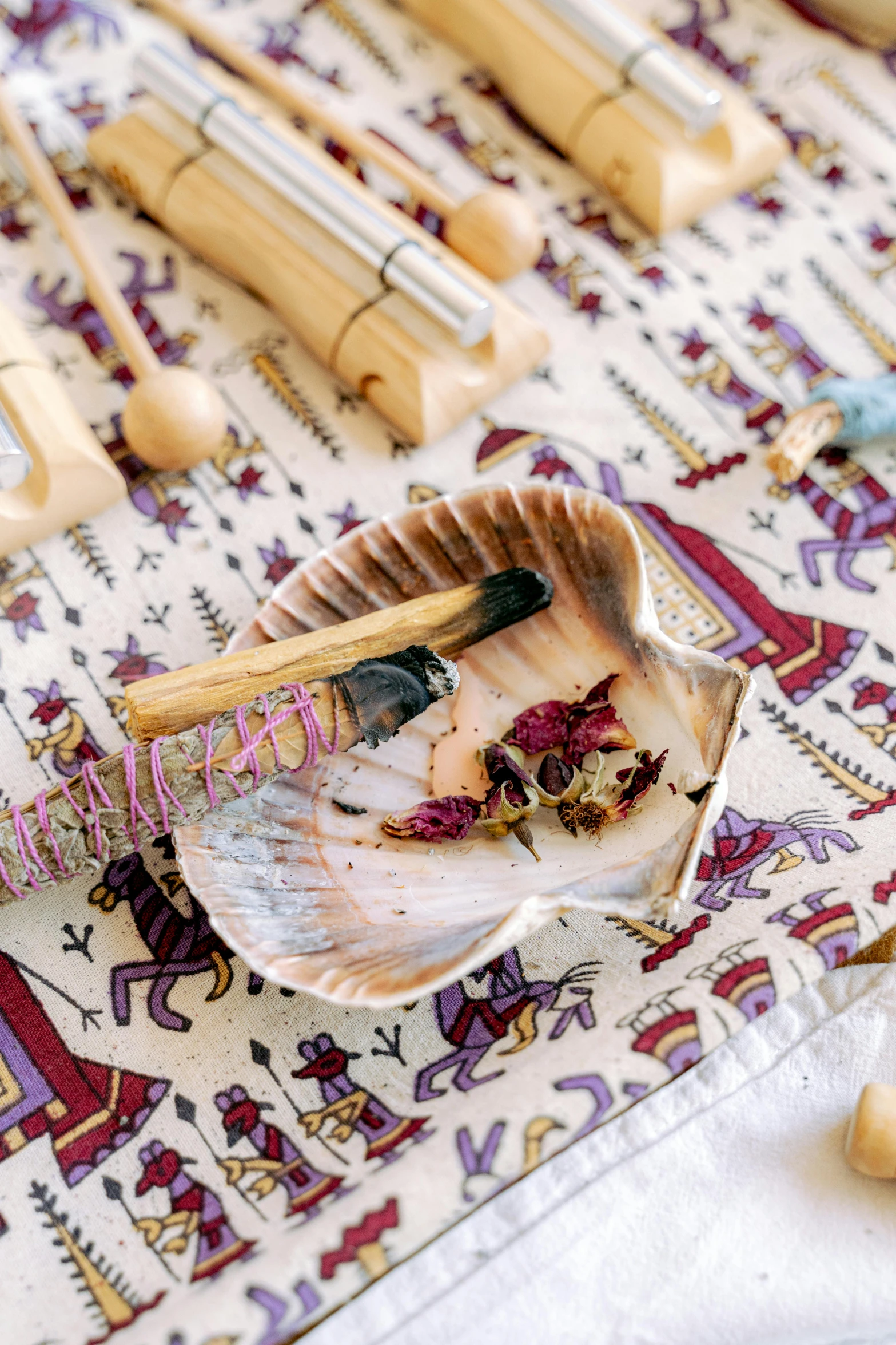 decorative crafting supplies displayed on oriental patterned table cloth