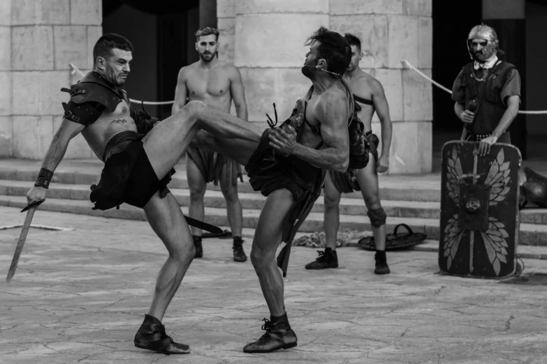 black and white pograph of three men in the city