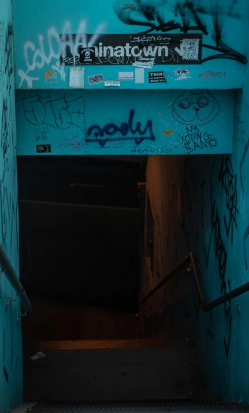 an open doorway that has graffiti on it