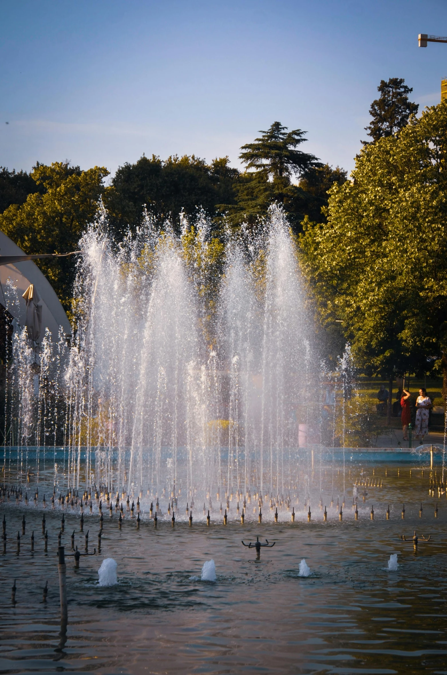 a large fountain has water spewing out from the sides