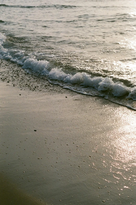 two surf boards that are in the sand