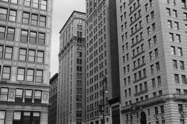 a black and white picture of some very big buildings