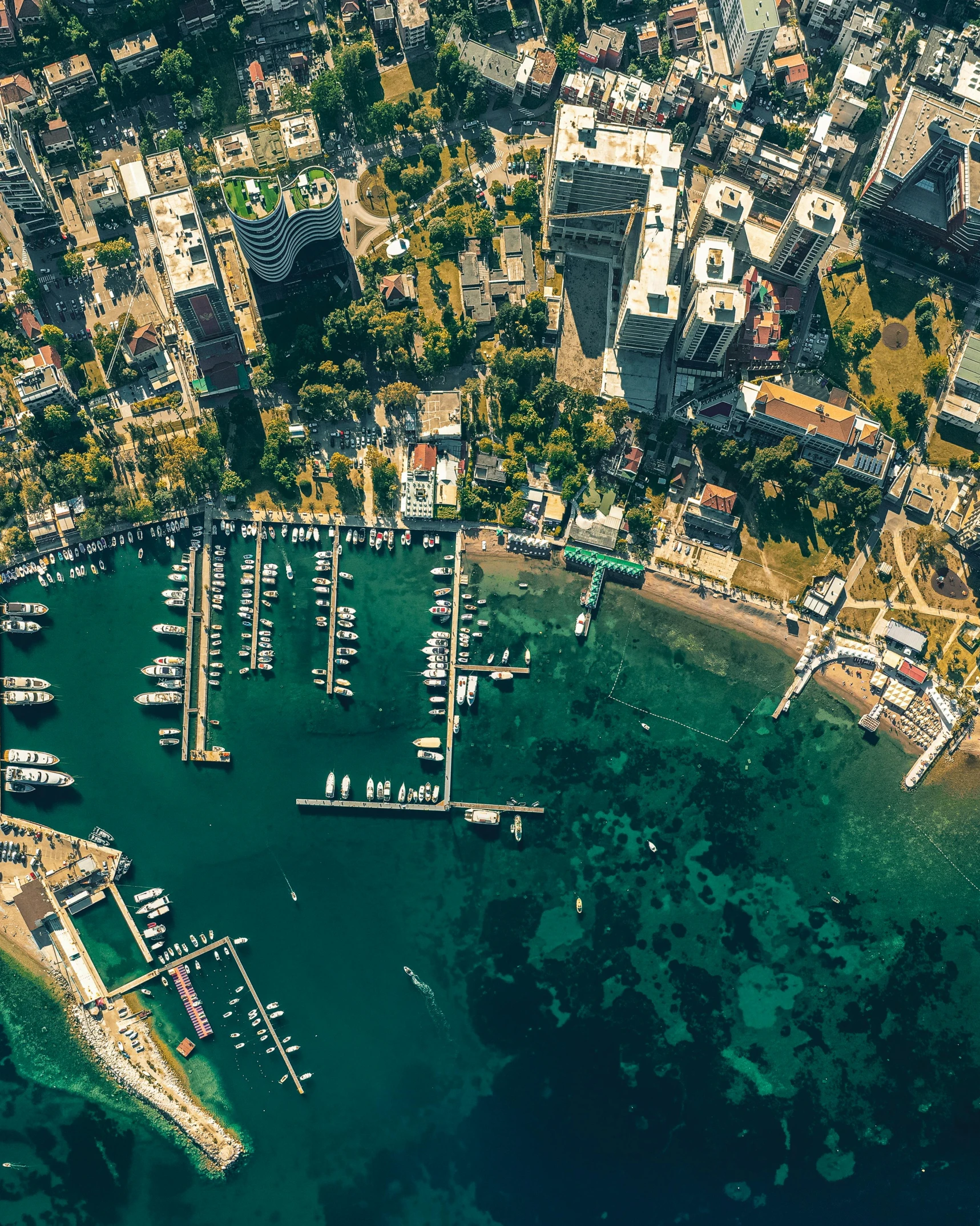 an aerial view of several boats docked in a bay