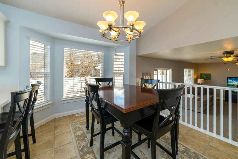 dining area with bay window and hardwood floor