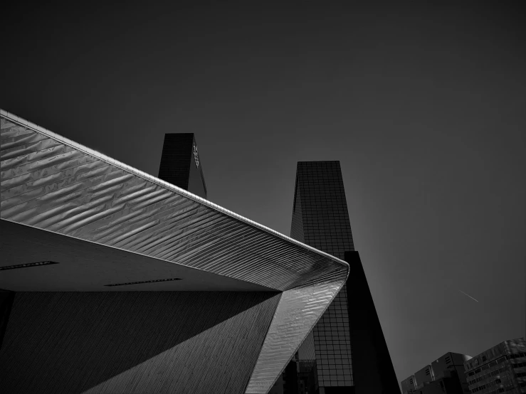 a black and white po with a building in the background