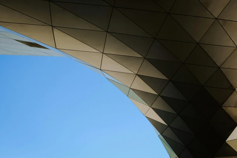 the underside of a building in blue sky