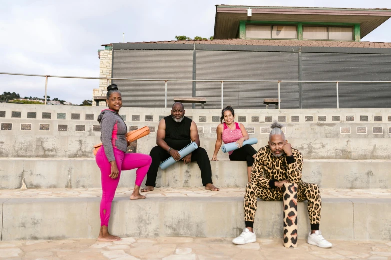 four people in tights are sitting next to each other