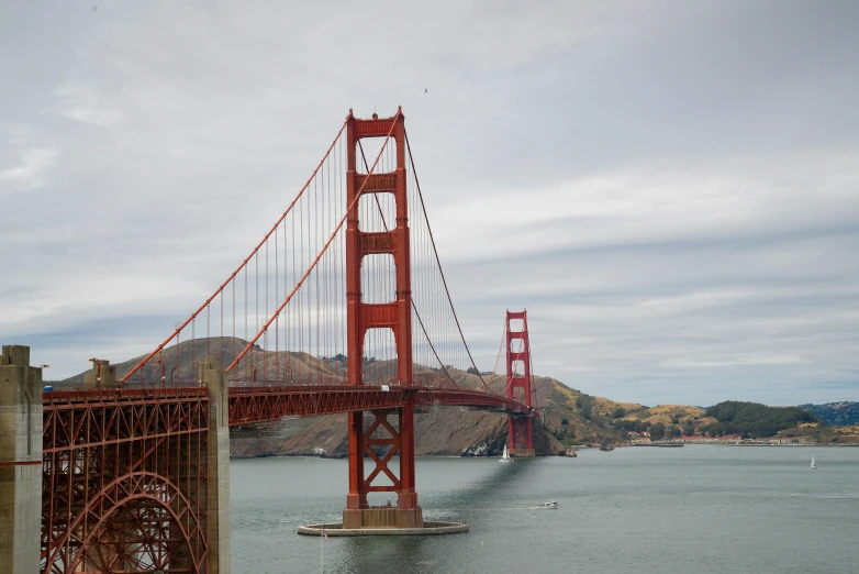 the red bridge stands tall over the water