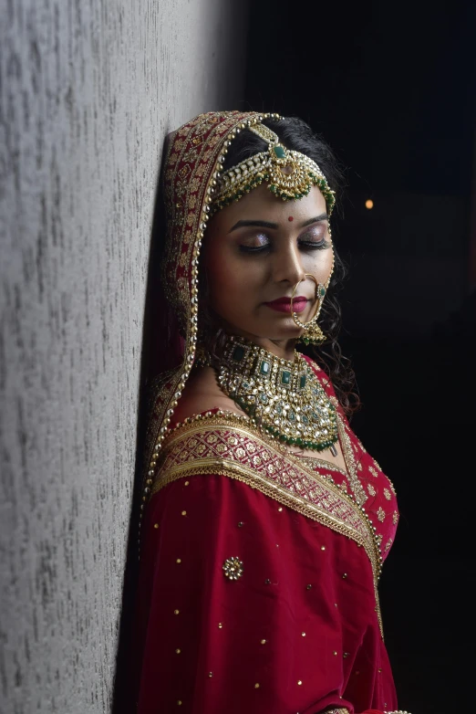 a woman with an indian headdress poses for a picture