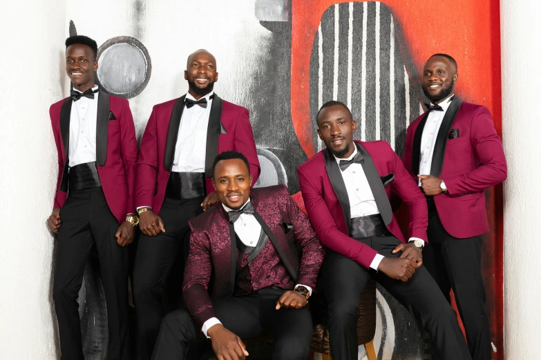 several men in tuxedos are posing together for a po