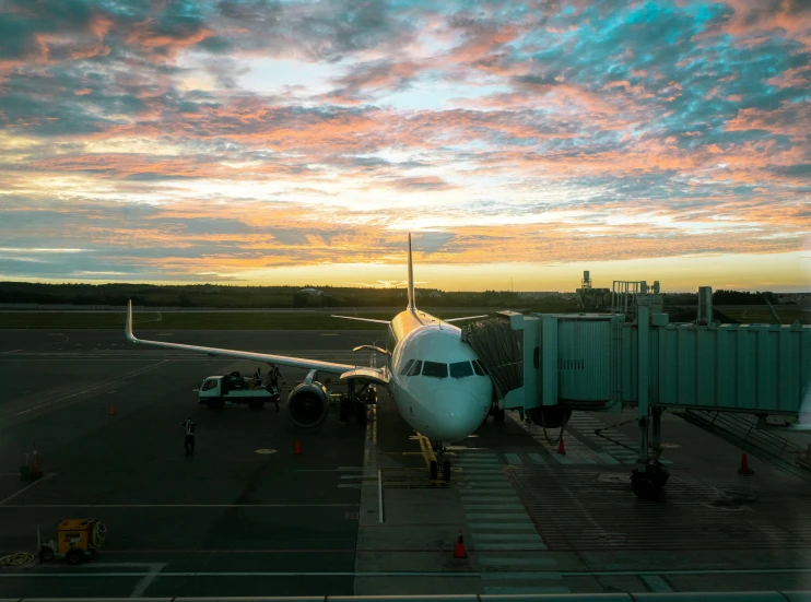 a plane sitting on the tarmac at an airport