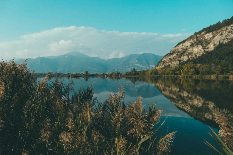 the mountains are covered in clouds and water