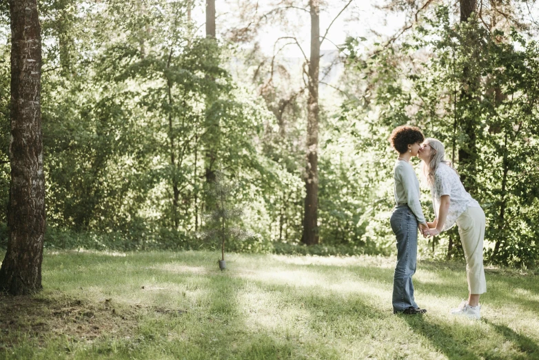 two young people in a park in the shade