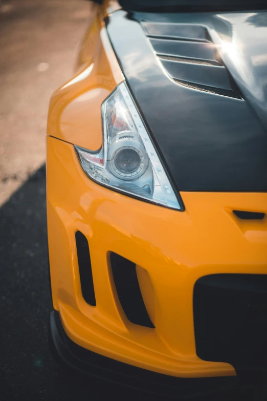 this yellow sports car is parked in a parking lot