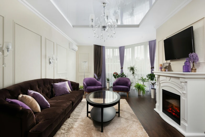 an elegant living room with a tv on the wall and chairs on the floor