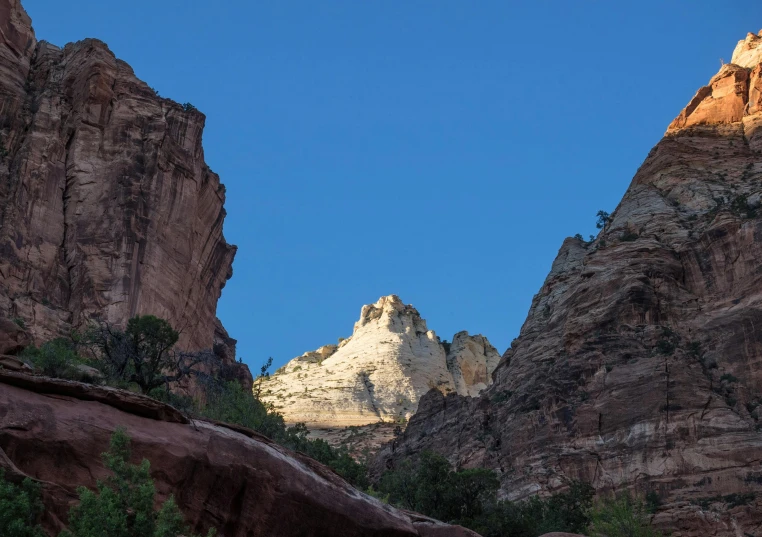 a clear view of cliffs in the background and blue sky