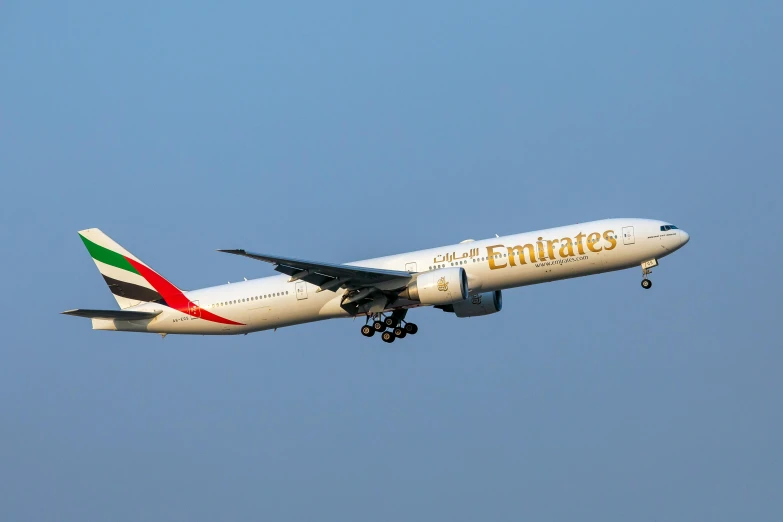 an emirates airplane flying in the sky