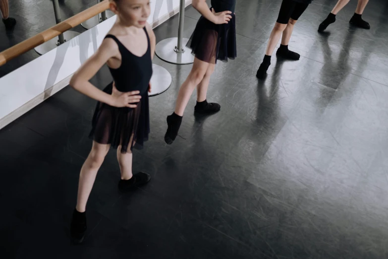 a  in front of a mirror in a ballet pose