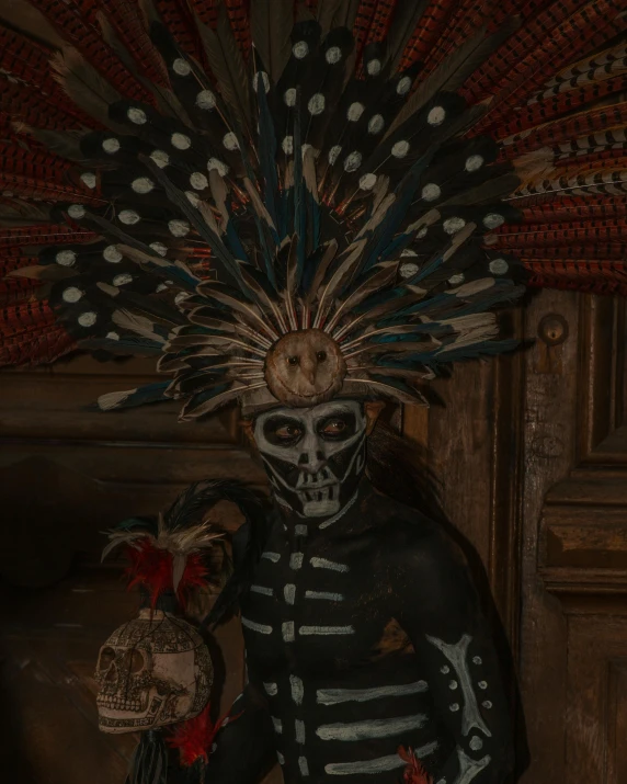 a skeleton with a decorated hat, holding a fan