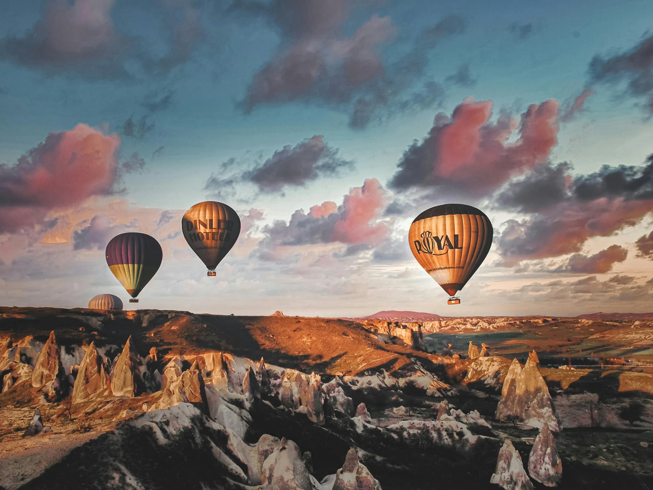 the  air balloons are above the rock formations