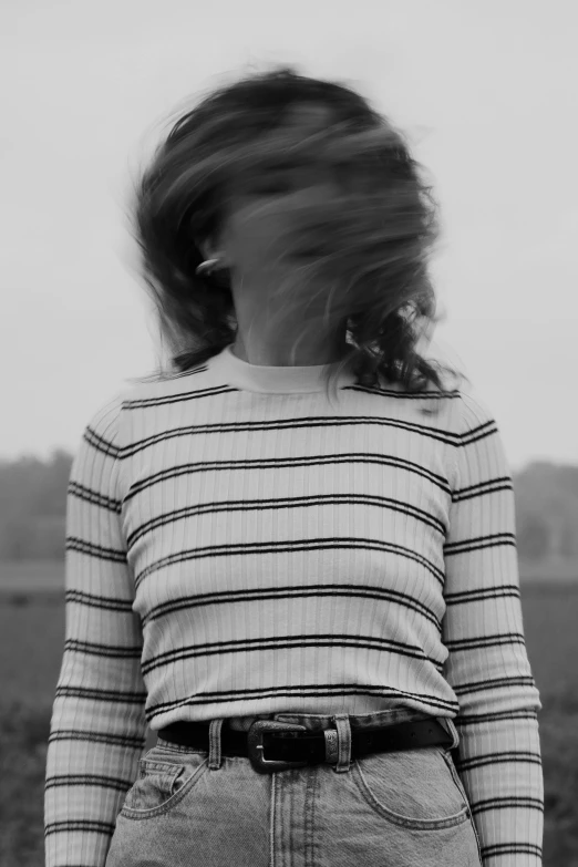 black and white po of young woman with long hair