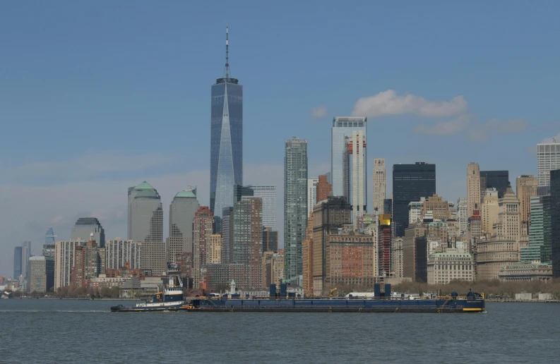 a body of water with a cityscape in the background