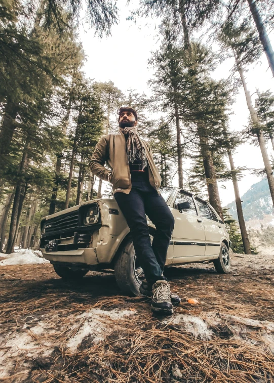 a man standing next to his white truck