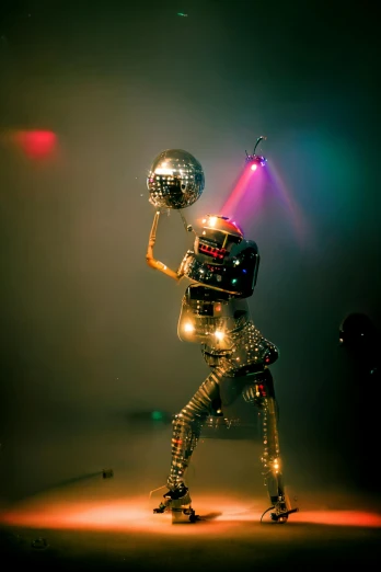a person with a disco ball in their hands
