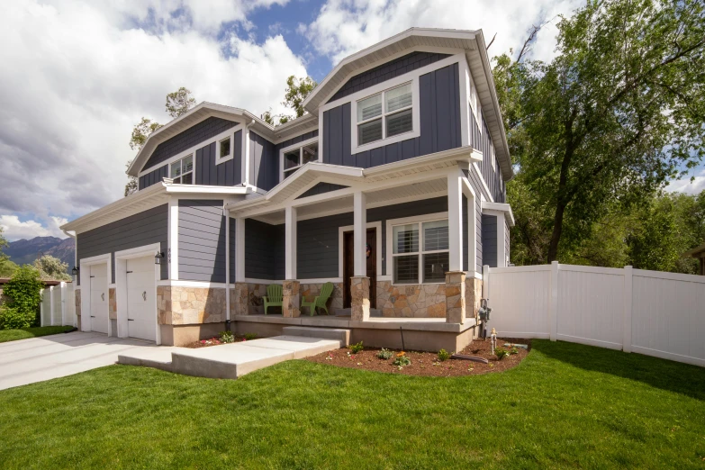 a house with a very large front porch and a large garage