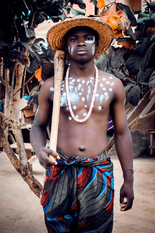 a man wearing feathers and feathers on his face