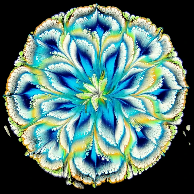 a computer generated flower in blue, yellow and green