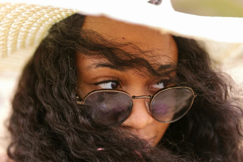 a close up of a woman wearing sunglasses