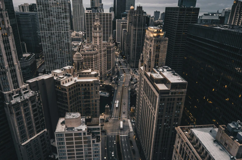 view of downtown city at night from the roof of a tall building