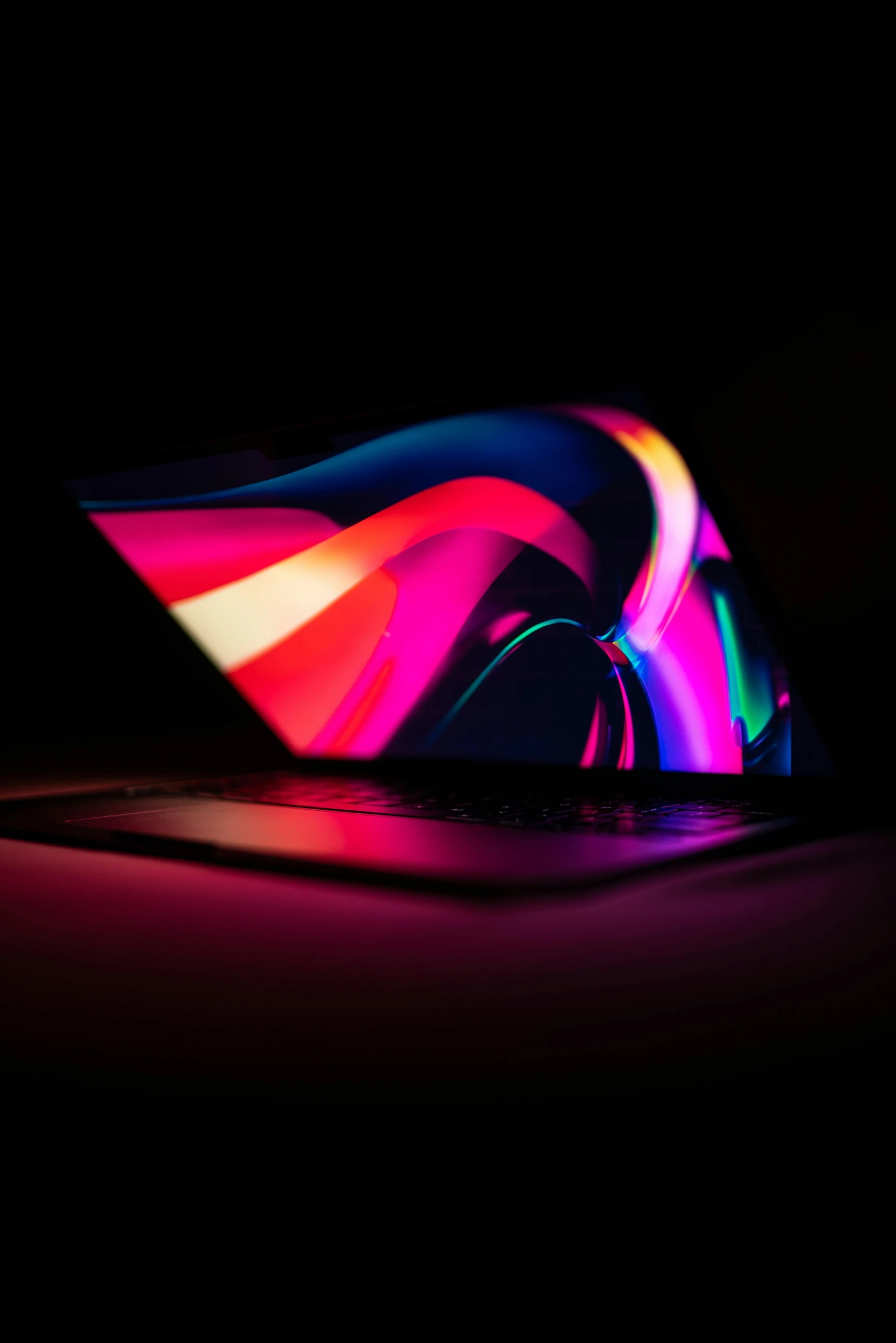 a colorful computer mouse with dark back ground