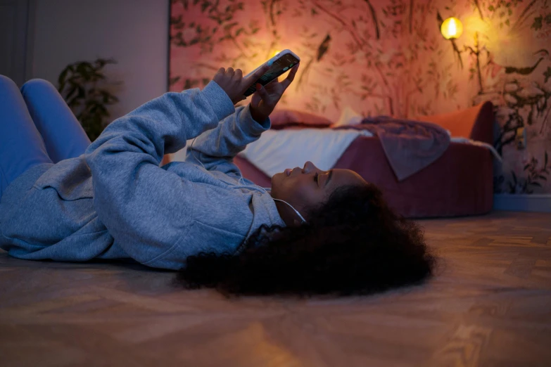 a woman laying on the floor with her hair down