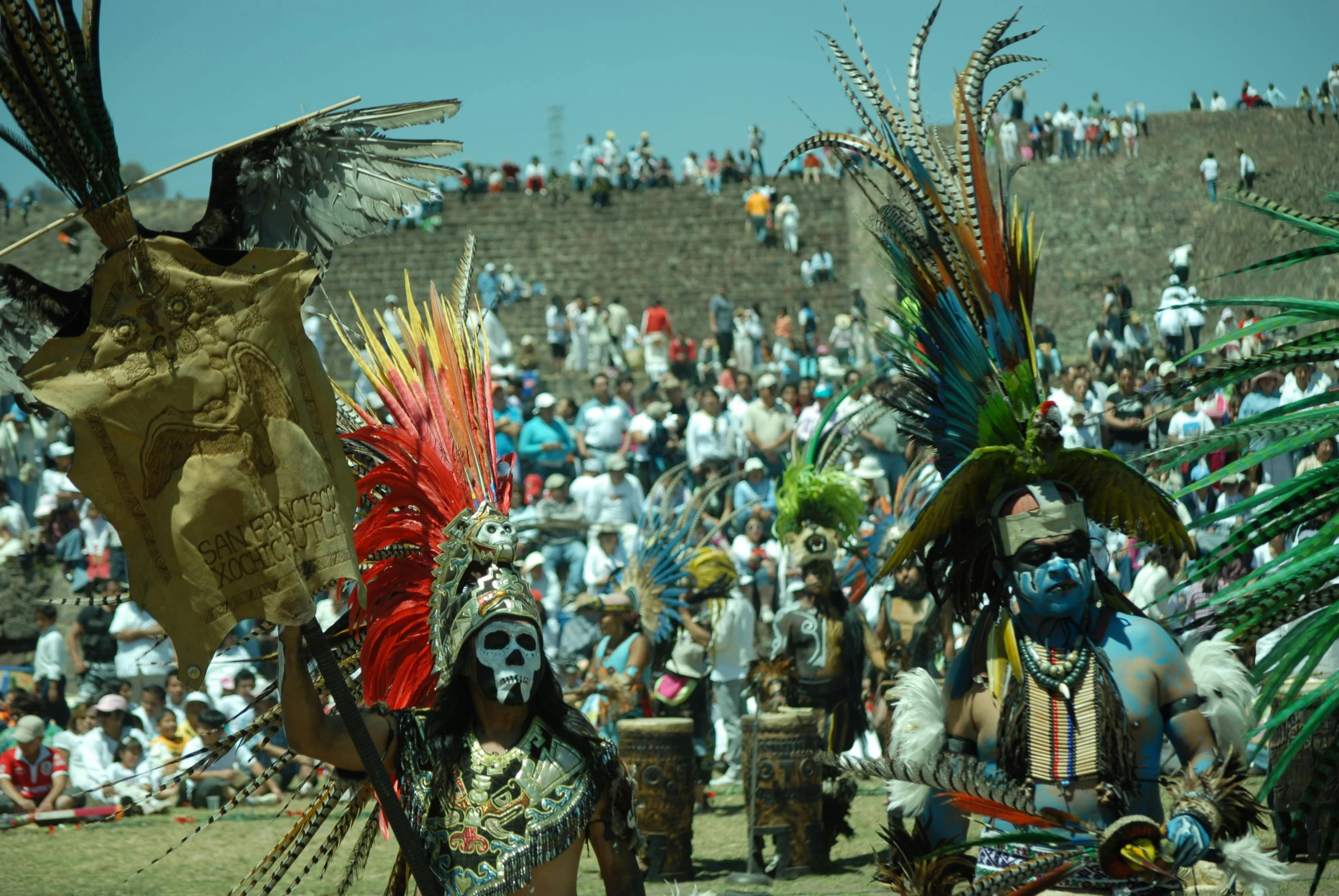 two people in costume, with masks and face paint