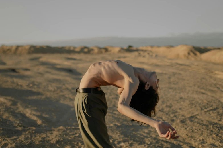 a woman in the desert posing for a picture