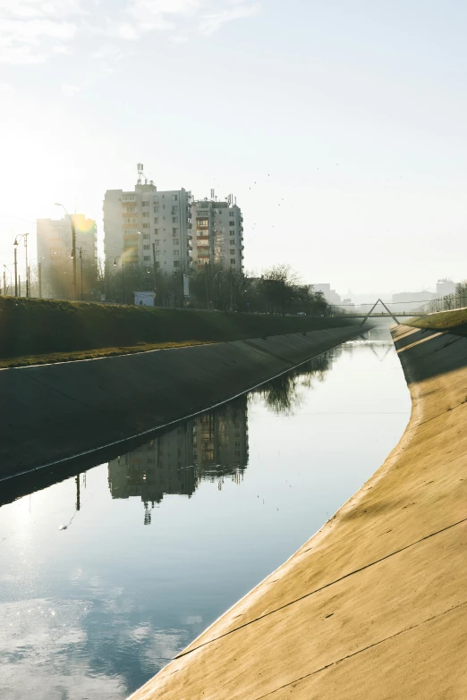 a skateboarder is riding along the side of the water