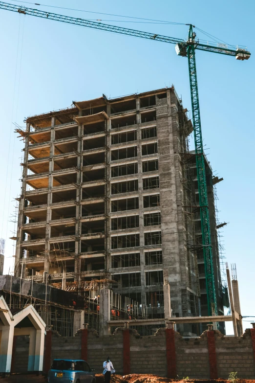 a large building with a crane next to it