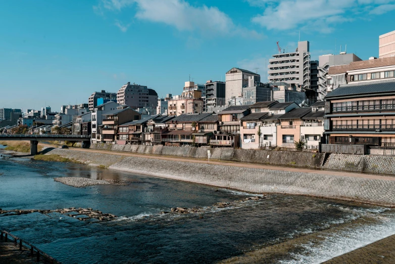 a body of water sitting in front of tall buildings